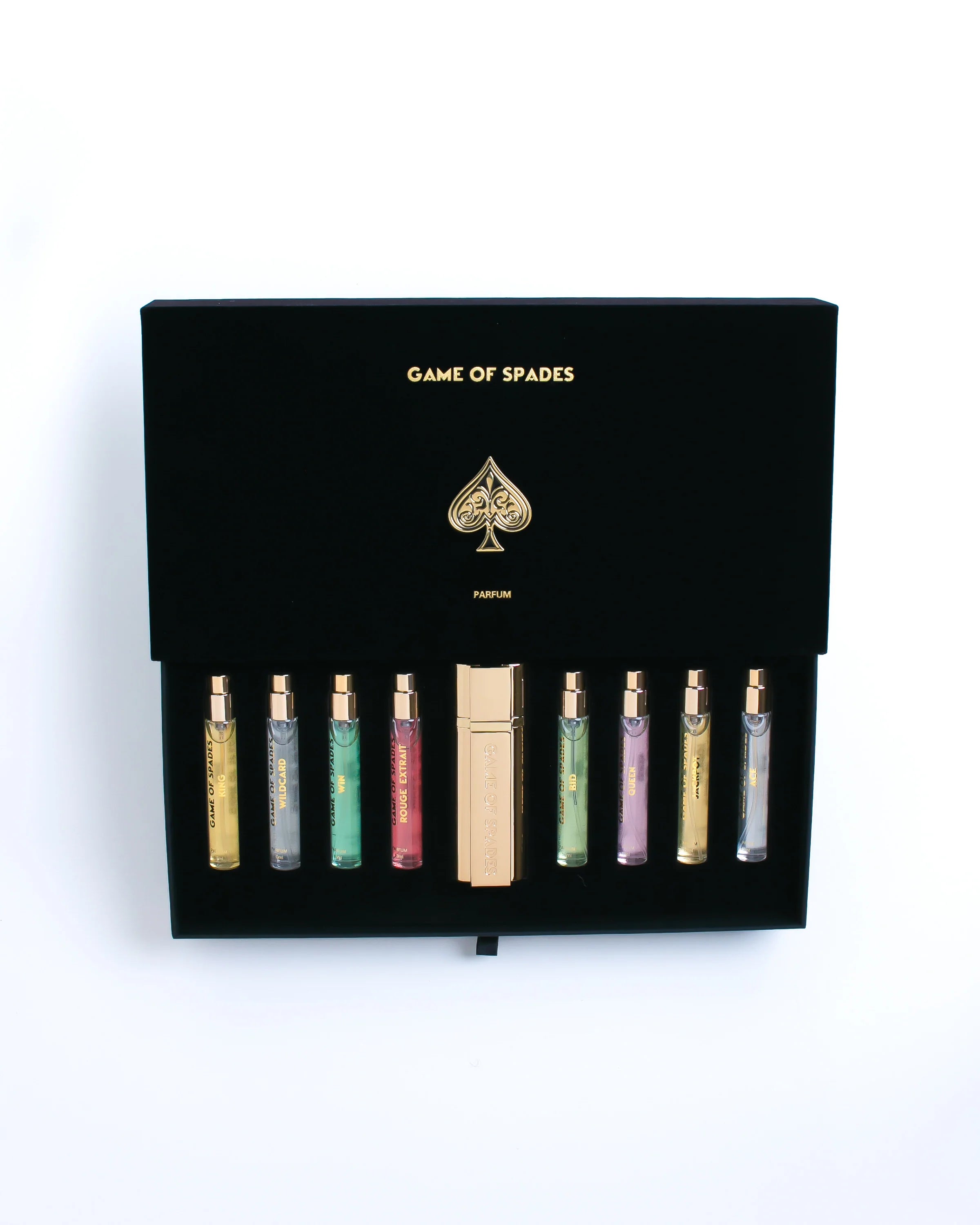 Set of perfume bottles in a black box with 'Game of Spades' branding on a white background